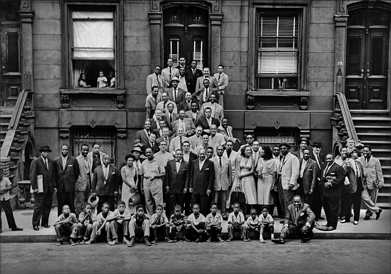 : Photo of hip-hop artists gathered on Harlem stoop