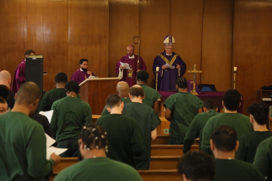 timothy is performing the mass in front of many inmates