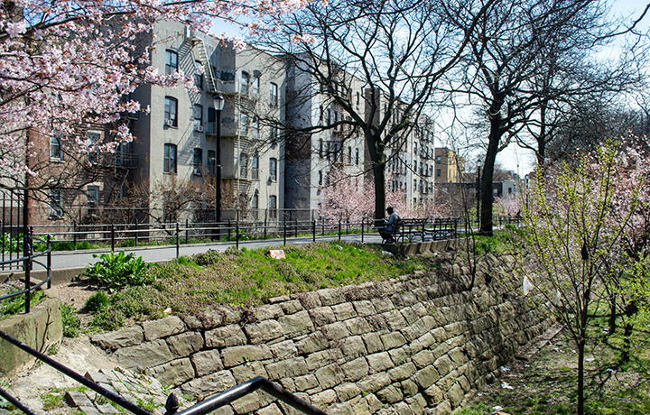 Elevated walkway atop brick embankment
                                           