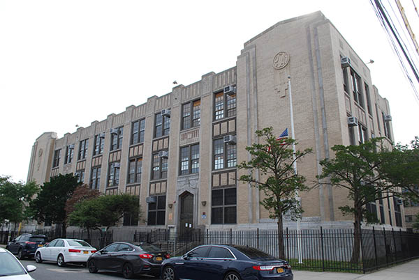 A view of the grey Art Deco-Style School in South Jamaica