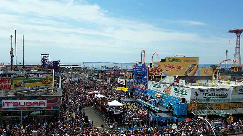 crowd viewing the Coney Island hot dog eating contest
                                           