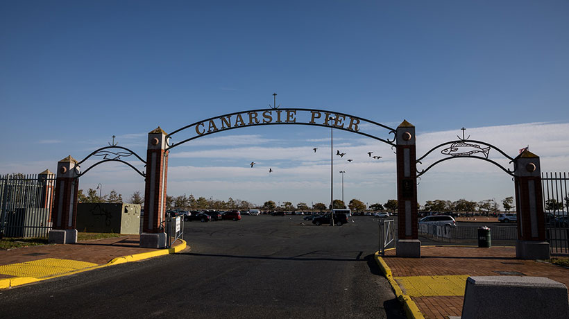 Entrance to parking lot that reads Canarsie Pier
                                           