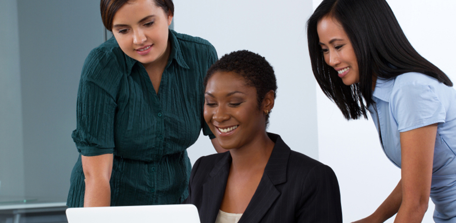 Three businesswomen discussing work
                                           
