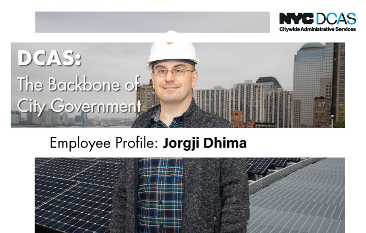 DCAS employee wearing a hard hat on a Manhattan rooftop cover with solar panels
                                           