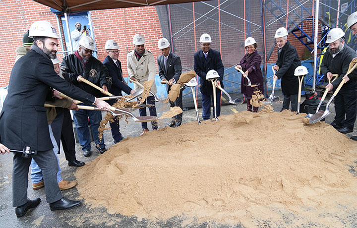 NYC officials with hard hats and shovels break ground for new development
                                           