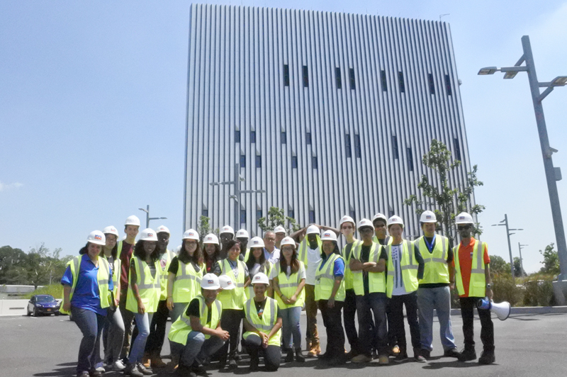 High School interns pose for a group photo in front of the Public Safety Answering Center II.