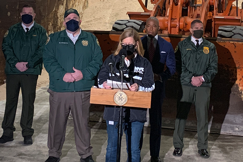 Christina Farrell (left) briefs media during a press conference with the NYC Department of Sanitation.