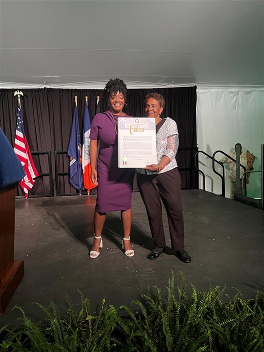 (from left to right) Commissioner Sideya Sherman of the NYC Mayor's Office of Equity and Doris Lango-Leak hold an honorary City Citation at the 2023 Juneteenth Event at Gracie Mansion.