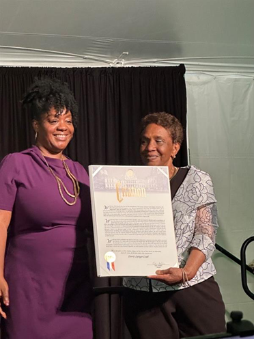 (from left to right) NYC Mayor's Office of Equity Commissioner Sideya Sherman presenting Doris Lango-Leak her honorary City Citation at the 2023 Juneteenth Event at Gracie Mansion.