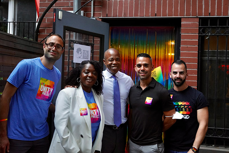 Mayor Eric Adams, Commissioner Sideya Sherman, the Mayor's Office of Equity, and Ronald Porcelli, Senior Policy Advisor for the NYC Unity Project, smile with staffers from the Ali Forney Center/Bea Arthur Residence.