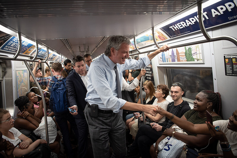 Mayor de Blasio in subway with passengers
