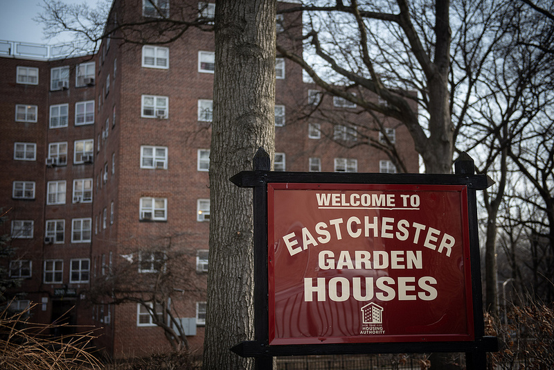 Eastchester Garden Houses Welcome Sign in front of buildings