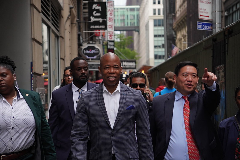 Mayor Adams walking to visit small businesses with Commissioner Kevin D. Kim
                                           
