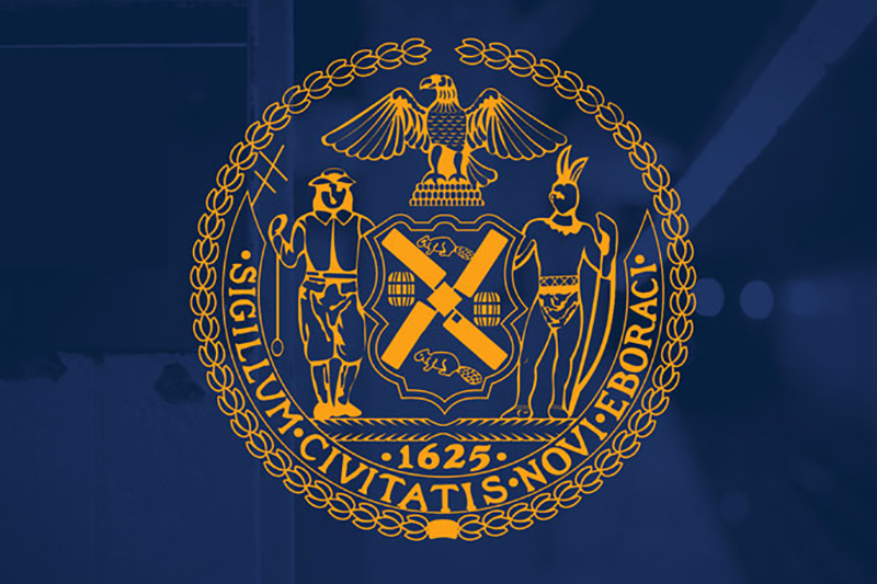 Gold NYC Seal on blue background.
                                           