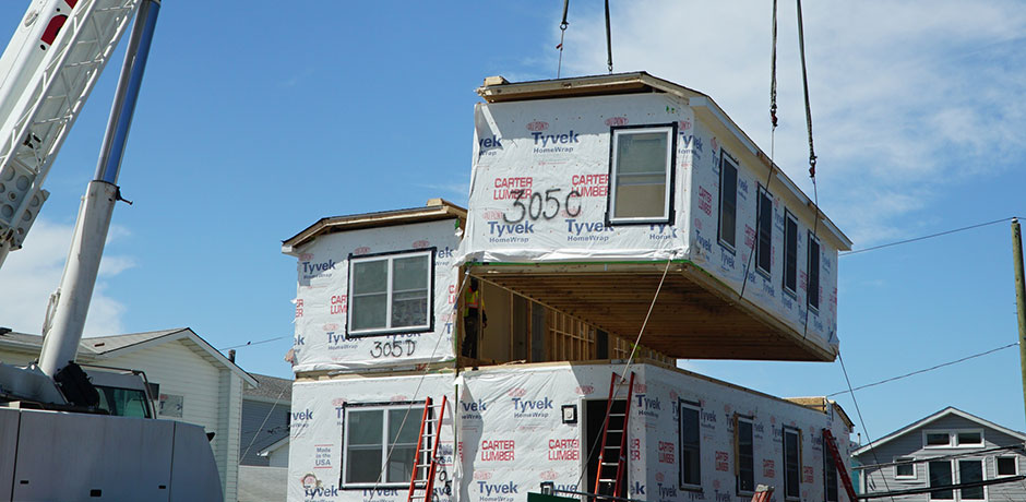 Modular home being lowered into place
                                           