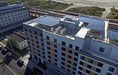 Aerial view of Beach Green Dunes building by the shore.