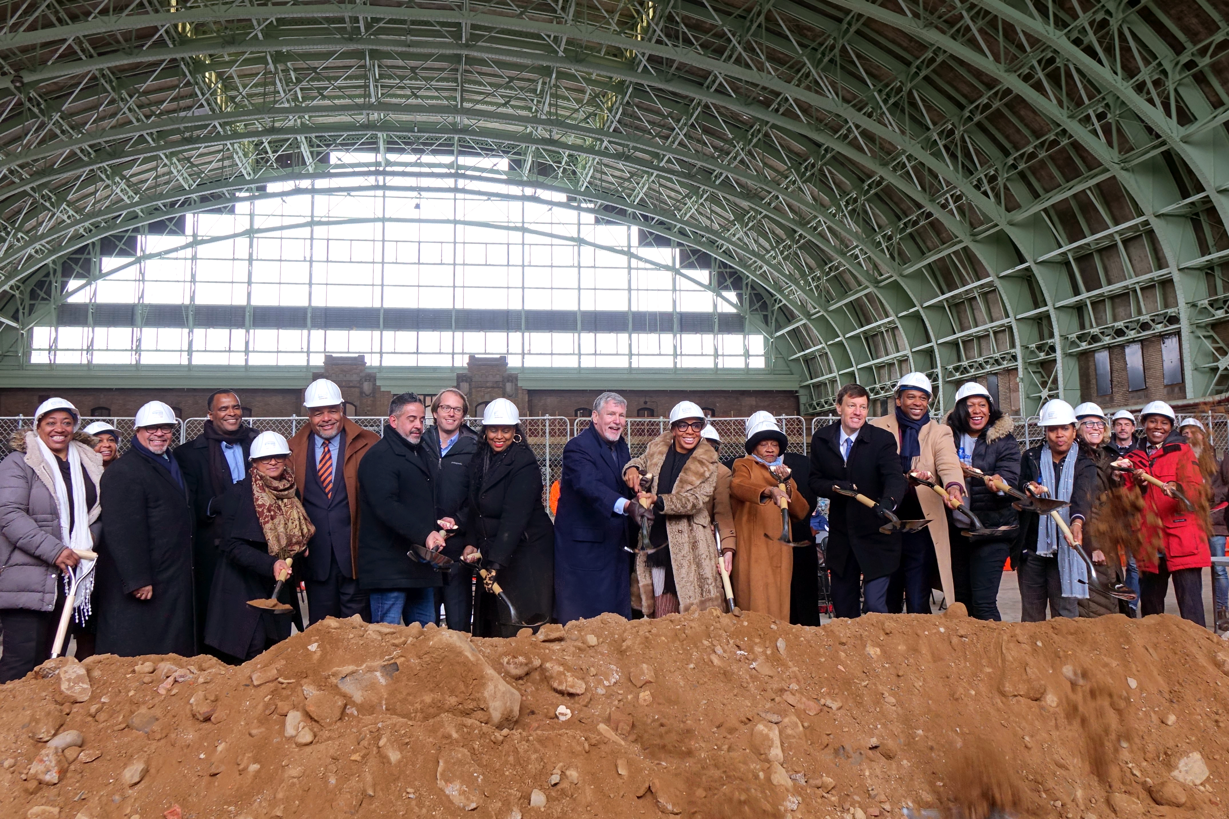 Partners and officials breaking ground at Bedford Union Armory
