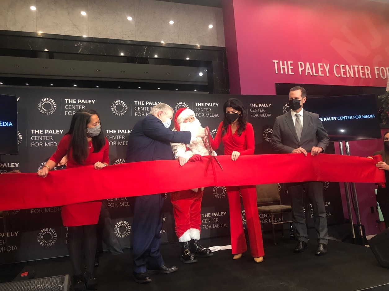 The Paley Center for Media Celebrated its Grand Reopening, with photo of Commissioner and others holding ribbon to be cut