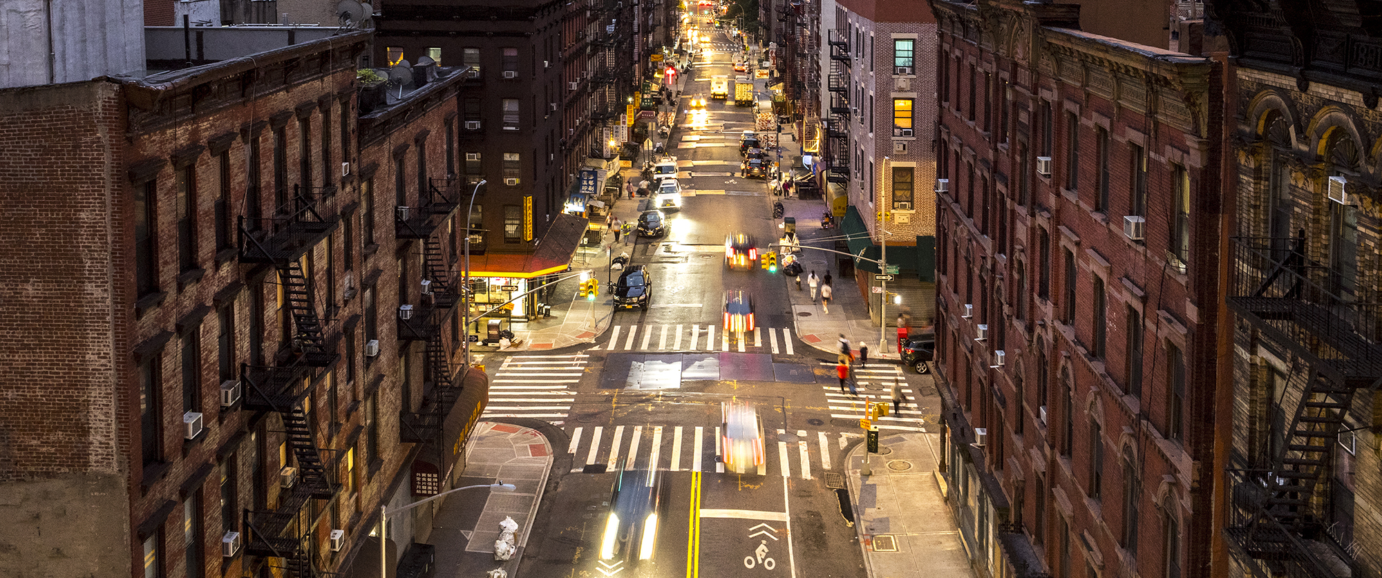Image of buildings and street at night in Manhattans downtown area