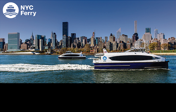 Two NYC Ferry vessels with the NYC Midtown skyline in the background
                                           