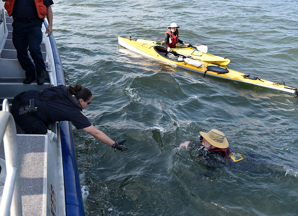 NYPD Harbor Unit officers rescue two kayakers who drifted far offshore