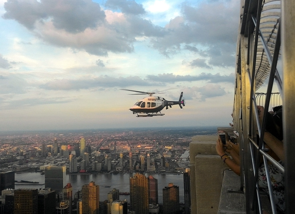 A tourist shares his scenic photos from the Empire State Building that include an NYPD Aviation Unit helicopter
