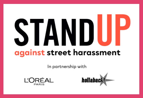 White graphic with magenta outline and text of Stand Up against street harassment, in partnership with L'oreal and hollaback!