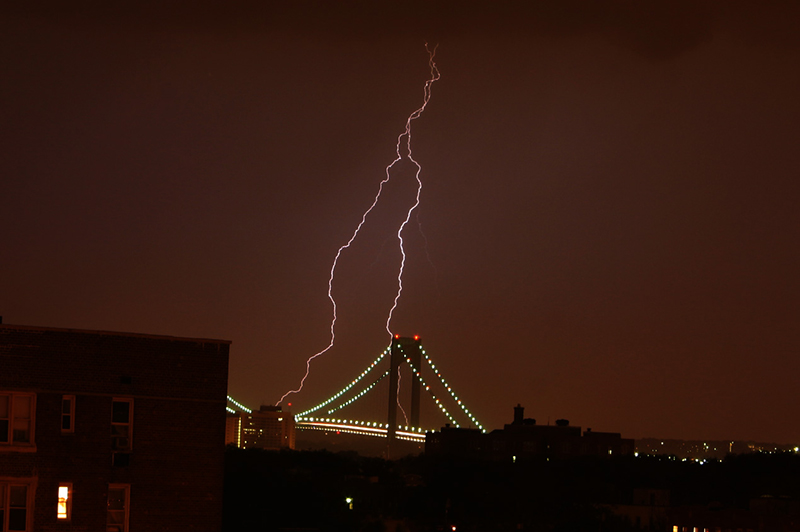 A photo of lightning striking the city skyline.
                                           