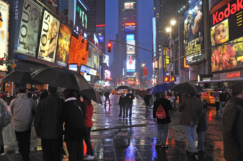 A photo of rain in Times Square.
                                           