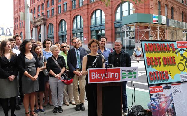 Commissioner Polly Trottenberg at podium maling a speech about Cycling in the City