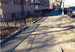 Before photo of the sidewalks outside South Jamaica Houses